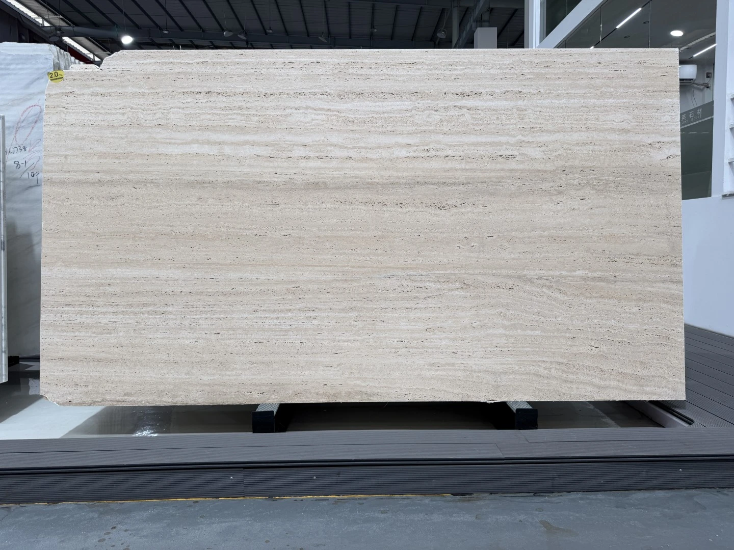 Italian Roman Travertine slab with warm ivory tones, natural pores and distinctive horizontal linear veining Italian Roman Travertine slab with warm ivory tones, natural pores and distinctive horizontal linear veining